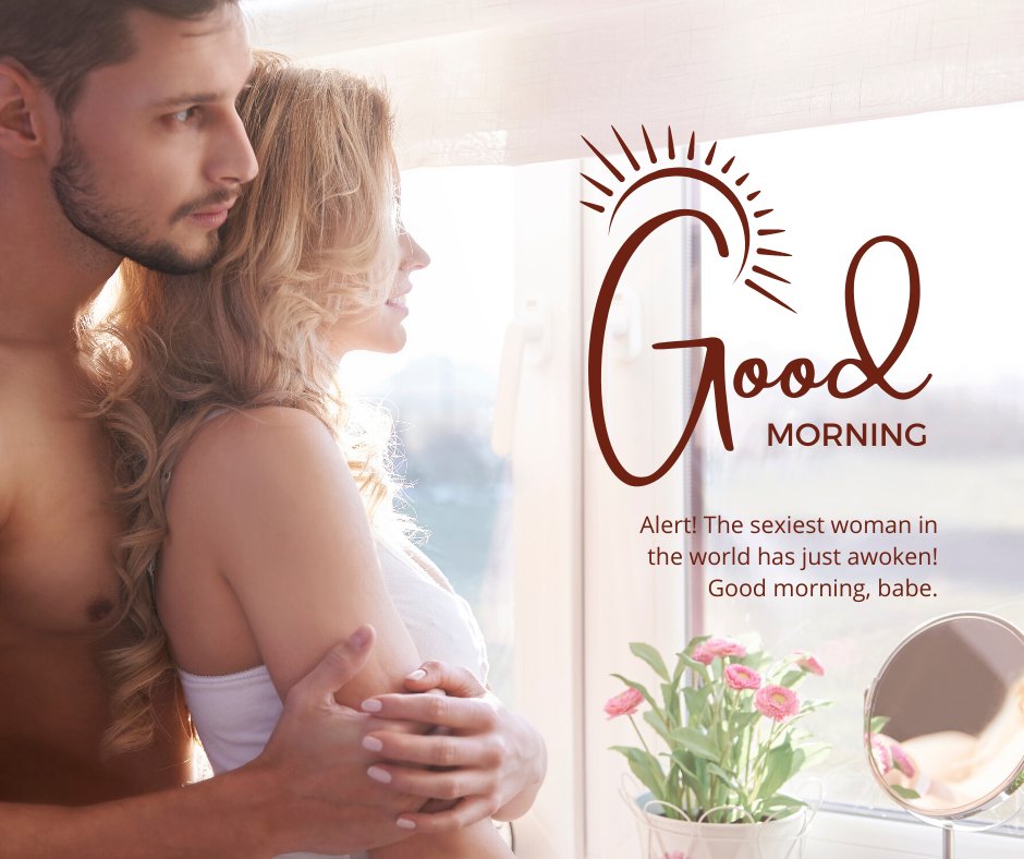 A man embraces his wife from behind as they stand by a sunlit window. The woman looks outside with a smile while the man gazes forward. The image includes the text 'Good Morning' and 'Alert! The sexiest woman in the world has just awoken! Good morning, babe.' This visual is perfect for funny good morning messages for a wife.